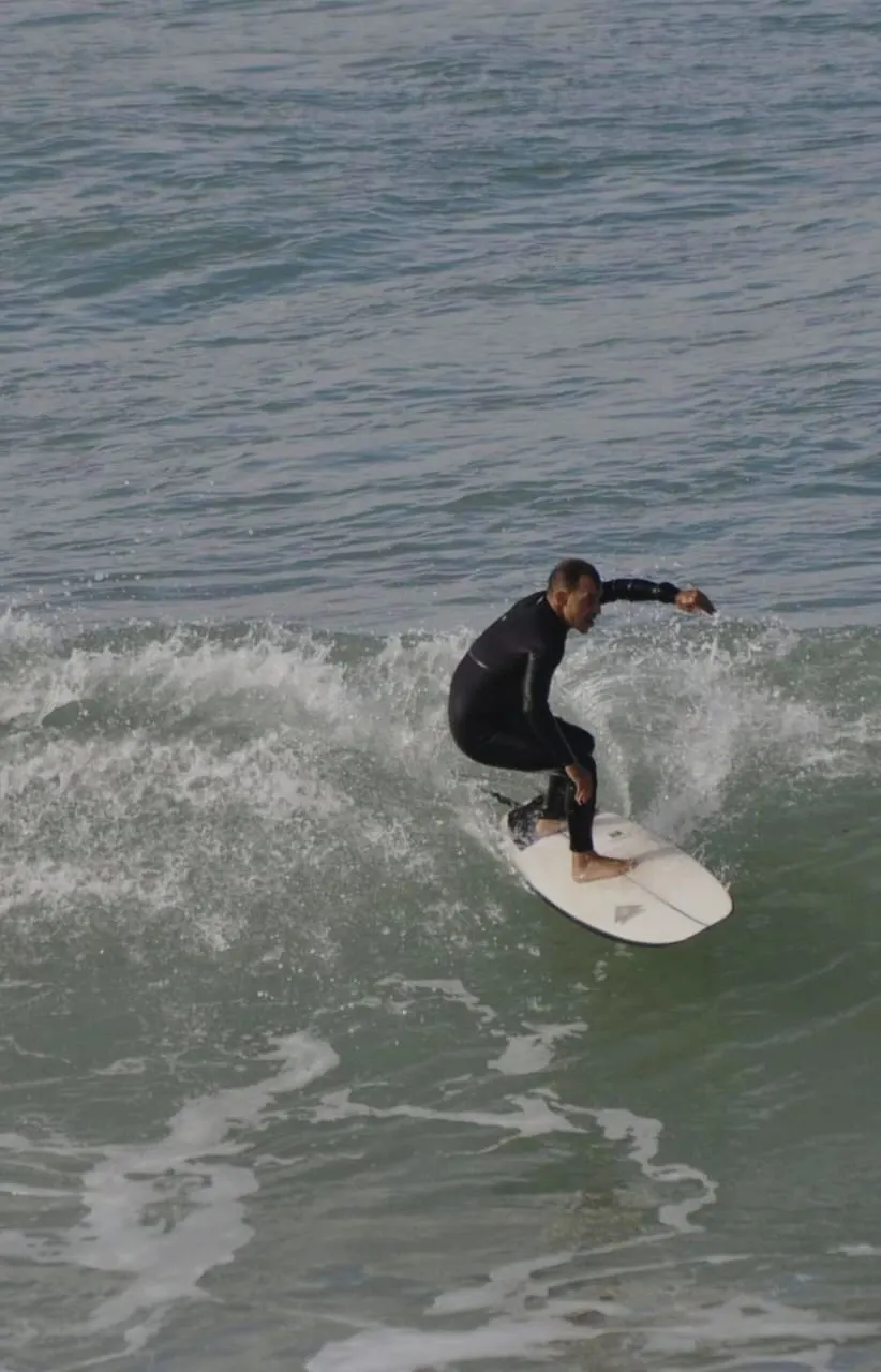 Surfer riding a clean wave on Morocco's Atlantic coast