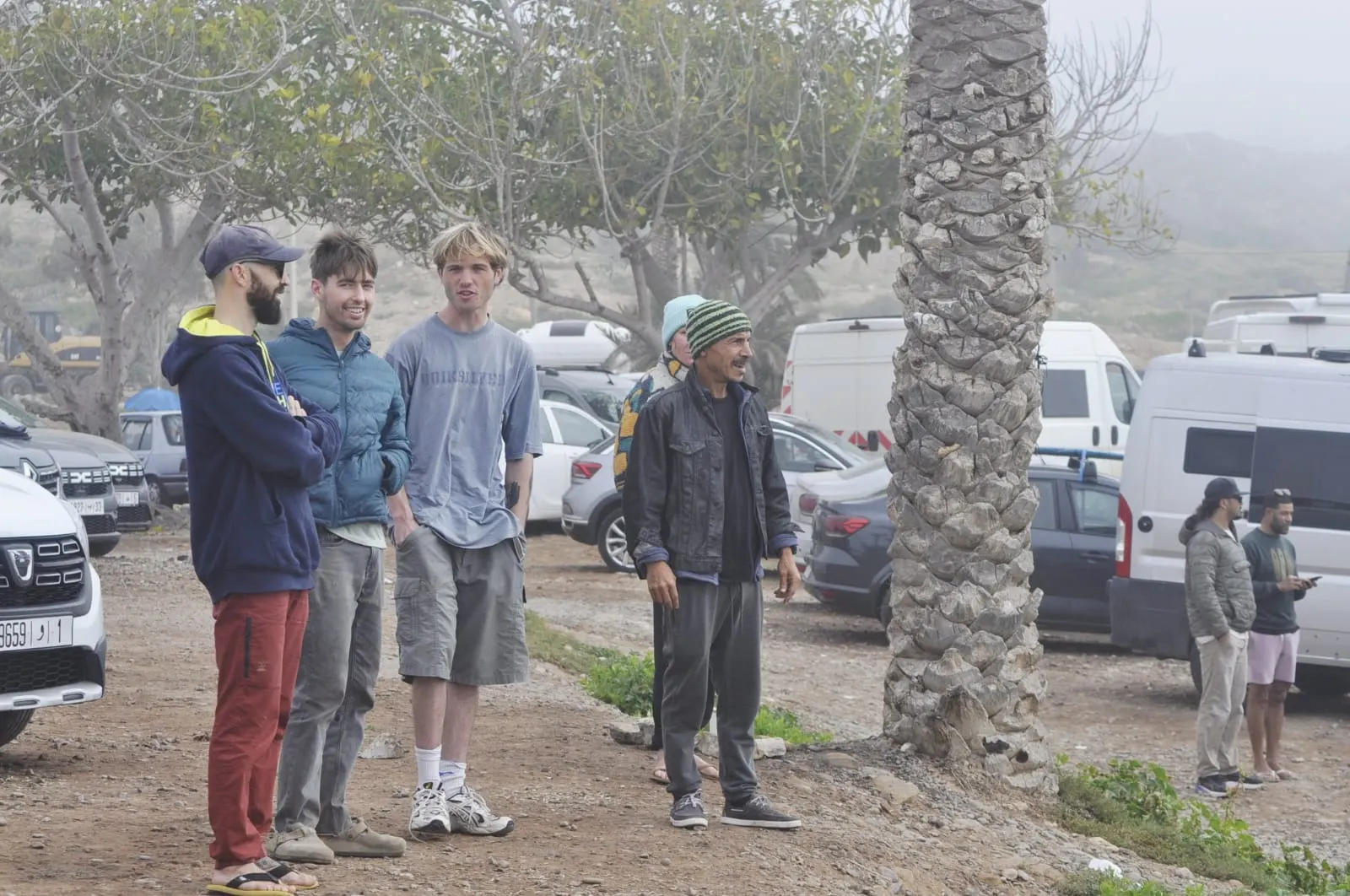 Ben Achir Yassni with surfers near a Moroccan Atlantic surf spot